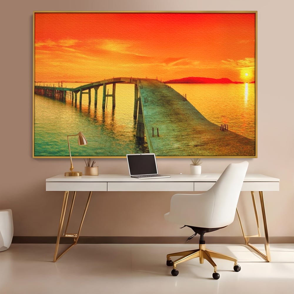 Tablou canvas cu tablou canvas cu pod si rasarit de soare, in rama de aluminiu auriu, pe perete intr-un birou